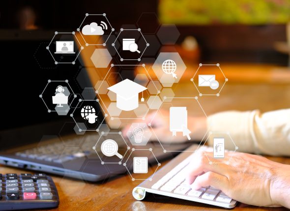 vecteezy_man-using-laptop-computer-with-education-icon-concept_3656056